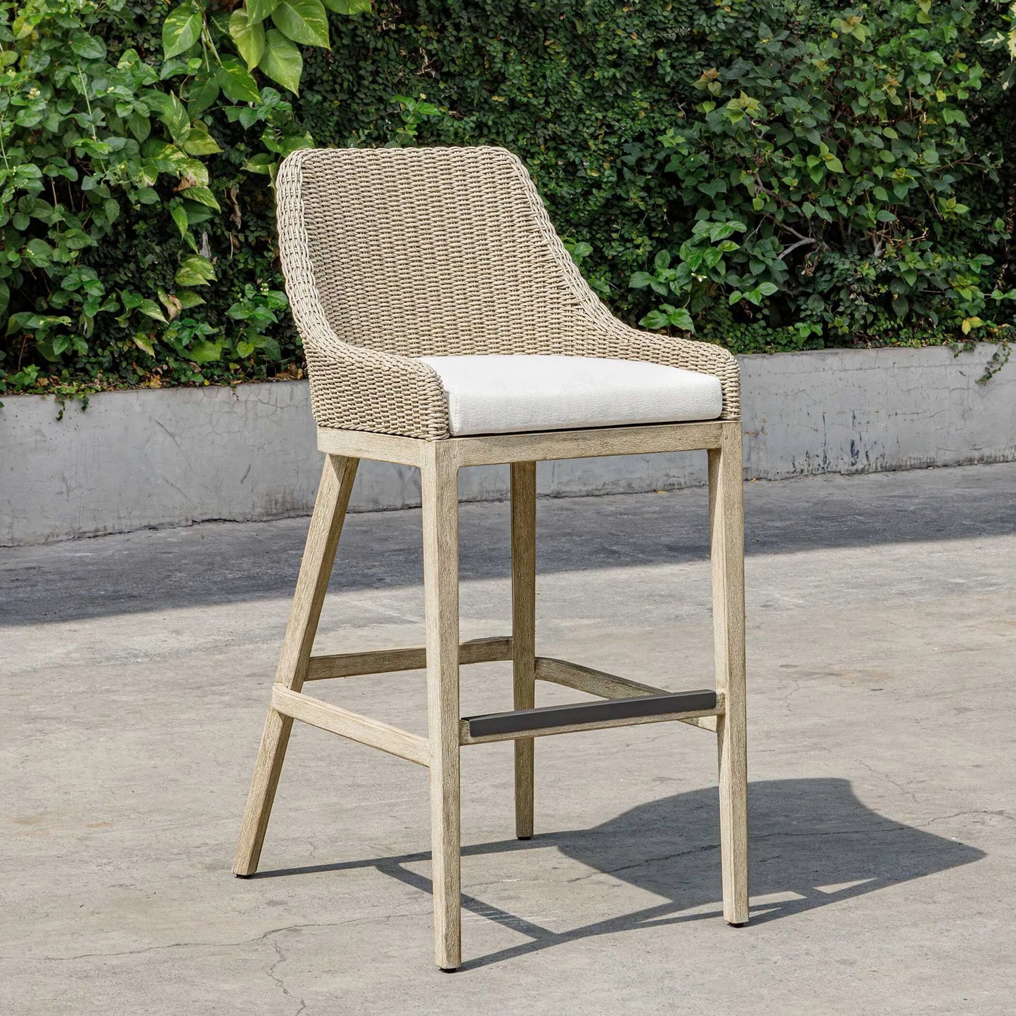 003 SI-2526345 | Lifestyle | Paloma Outdoor Wicker Bar Stool by Uttermost in gray, white and white. Made from mahogany wood, aluminum with wicker in a unique style.