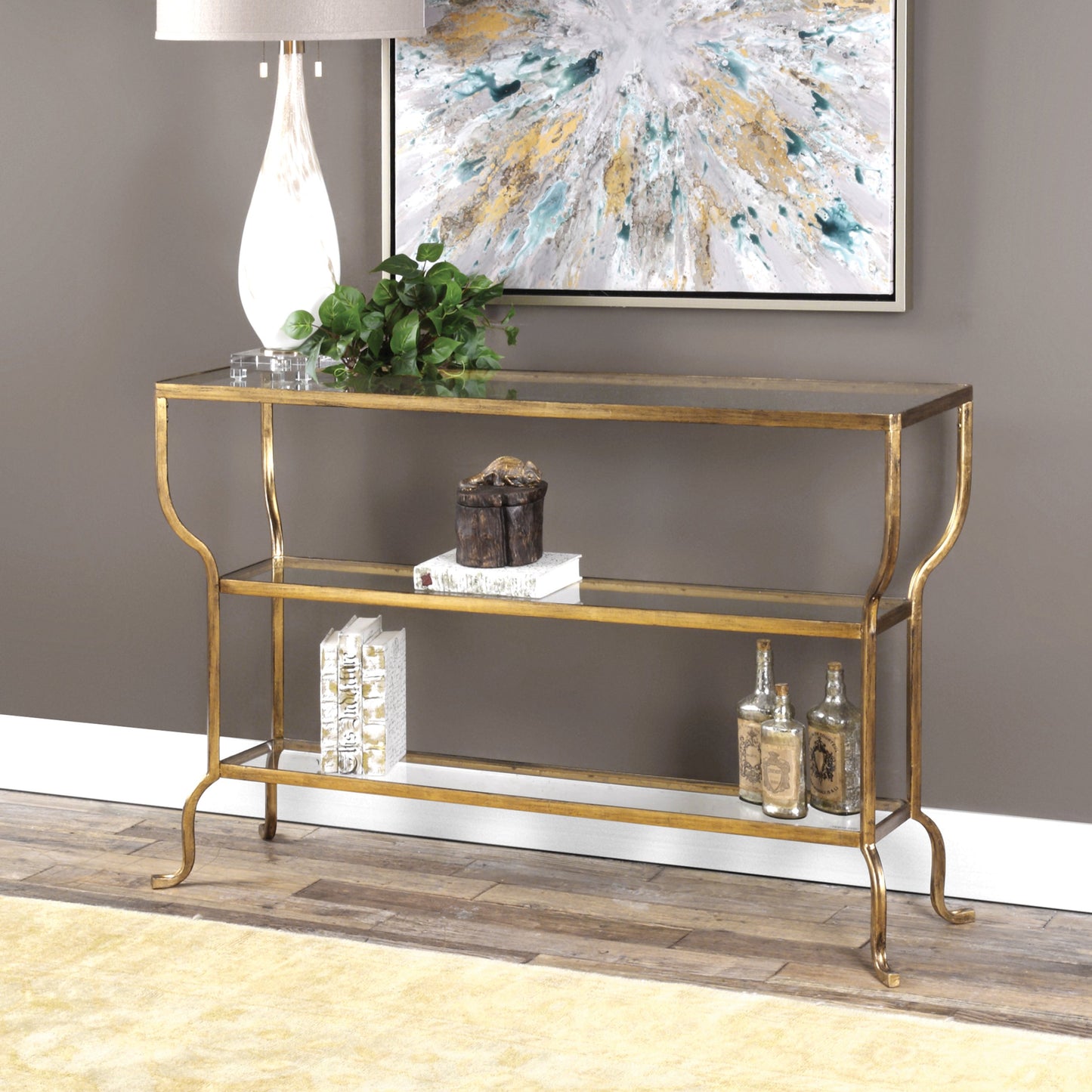009 S-253090 | Lifestyle | Deline Console Table by Uttermost in gold. Made from iron, glass in a modern style.