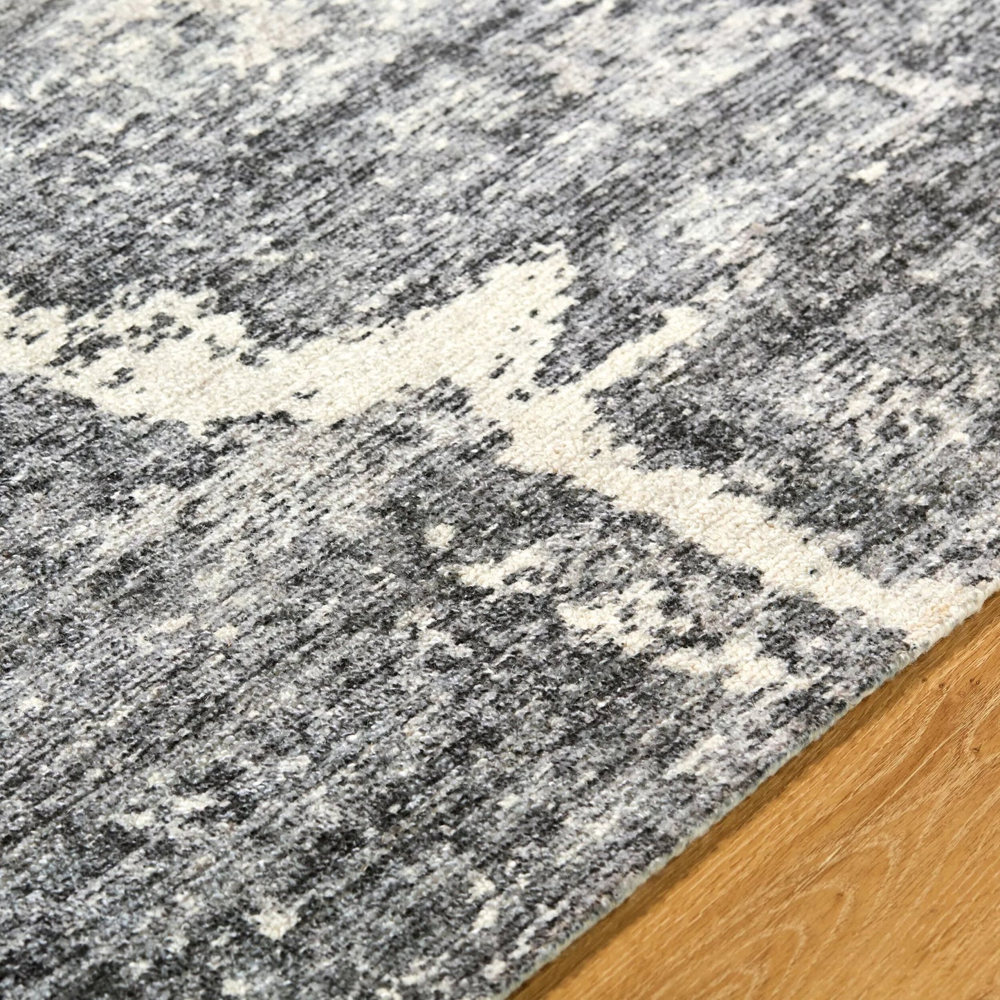 004 SI-2349672,SI-2349673,SI-2349674,SI-2349675 | Closeup | Janek GAJA-2302 Rug by Galey Alix x Livabliss in charcoal, ash gray, ivory. Made from polyester in a unique style.