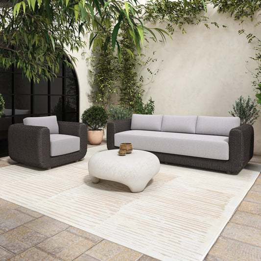 Soma Outdoor Accent Chair by Moe's Home Collection. Made from wicker, aluminum frame, 100% olefin fabric, quick dry foam cushion in a rustic style.