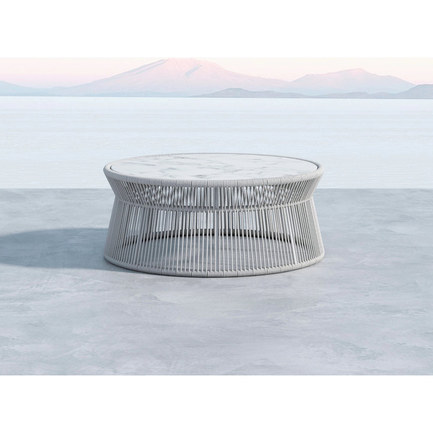 003 SI-2167069 | Lifestyle | Miami Outdoor Coffee Table by Sunset West in frost. Made from olefin rope in a coastal style.