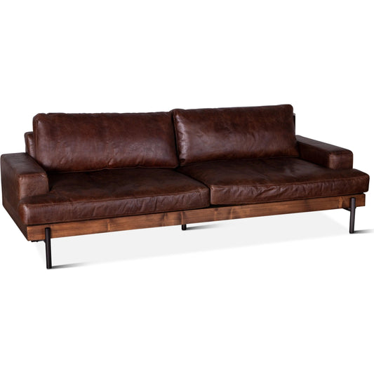 Chiavari Industrial Vintage Dark Brown Leather Sofa by World Interiors in geisha brown, antique zinc, medium walnut. Made from leather, foam, oak wood & iron in a transitional style.