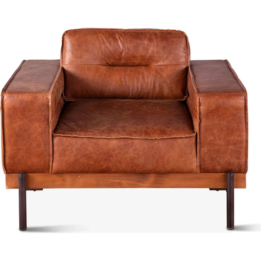 Chiavari Modern Cognac Leather Armchair by World Interiors in cognac, antique zinc, oak. Made from leather, foam, oak wood & iron in a transitional style.