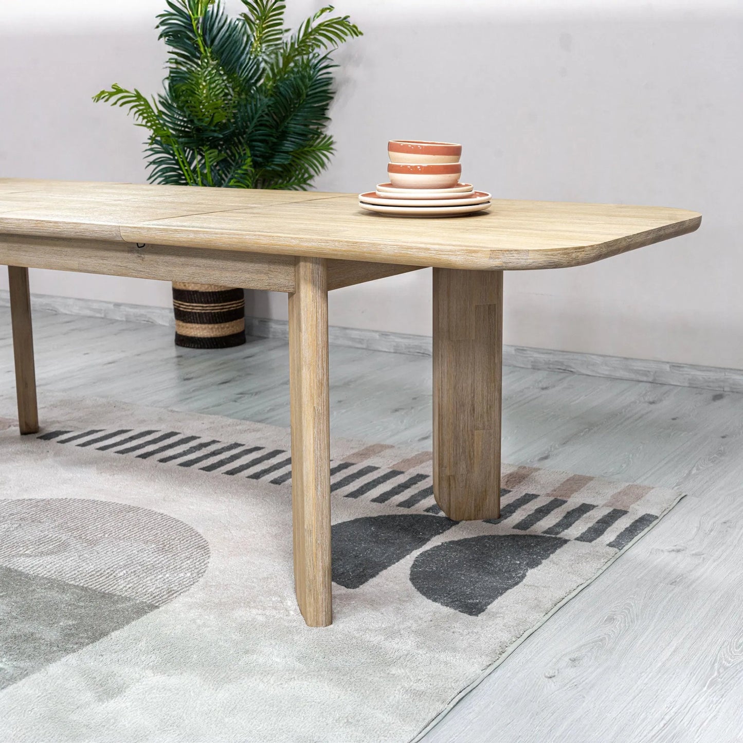 003 SI-2325068 | Unknown | Haru Extension Dining Table (70"/102") by LH Imports in beige and sand wash. Made from acacia in a unique style.
