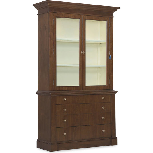 Archives Display Cabinet by Hooker Furniture in dark wood and classic walnut. Made from figured cathedral walnut veneers, oak veneers, birch veneers with tempered glass, a light in a traditional style.