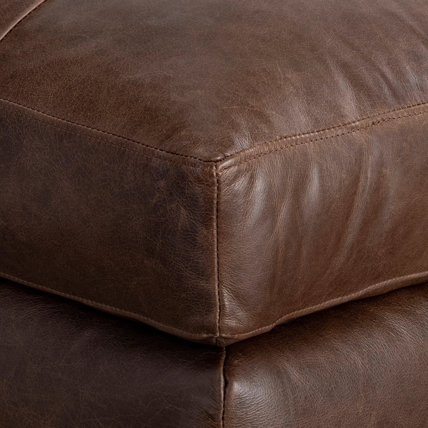 006 SI-2539257 | Closeup | Nest Leather Ottoman by Bernhardt in brown. Made from leather in a unique style.