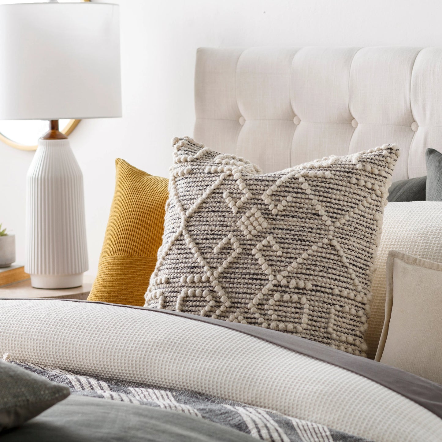 004 SI-1882679,SI-1882680 | Lifestyle | Hygge Pillow - 25994 by Livabliss in black, cream. Made from 40% cotton, 30% polyester, 30% wool, 100% cotton in a eclectic & global style.