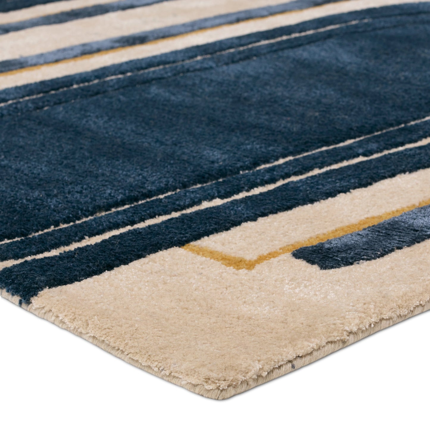 002 SI-2123567,SI-2123568,SI-2123569,SI-2123570 | Closeup | Iconic Partition Rug by Jaipur Living in navy, cream. Made from 60% viscose, 40% wool in a unique style.