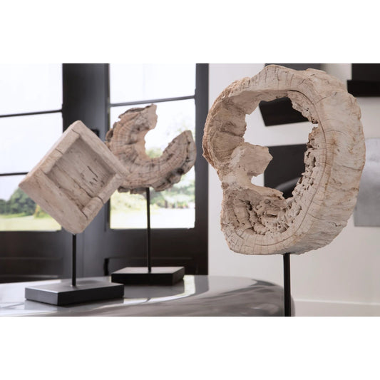Eroded Wood Circle Sculpture on Stand by Phillips Collection in brown, black. Made from wood, metal in a modern style.