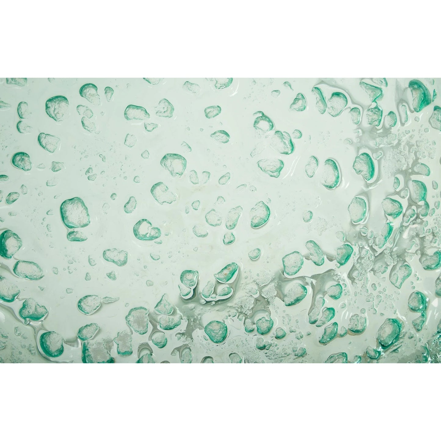 003 SR-939382 | Closeup | Bubble Glass Coffee Table by Phillips Collection in turquoise. Made from glass metal, stainless steel in a coastal style.