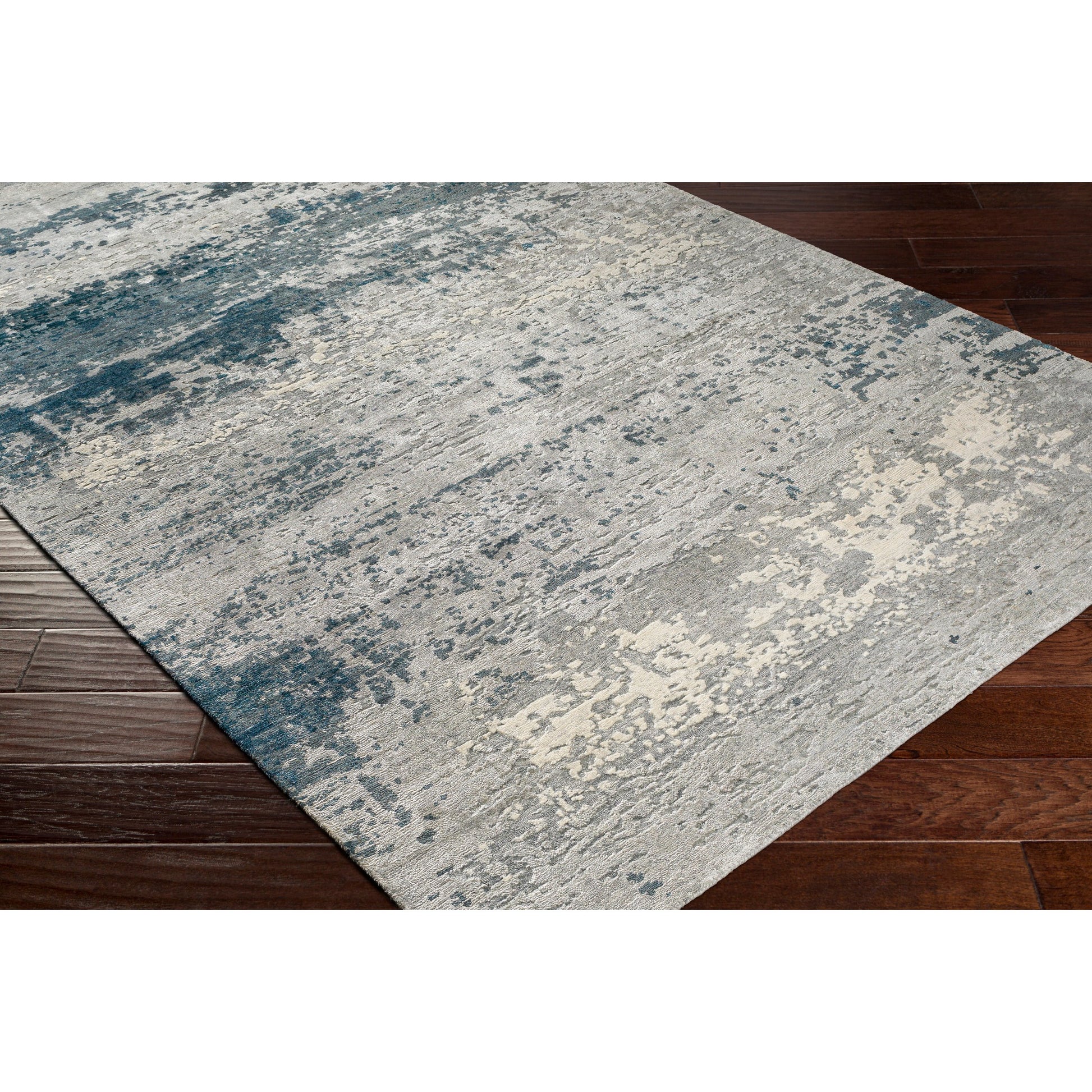 Imola Rug - 26077 by Surya in light beige, gray, light gray, dark blue, teal, charcoal. Made from 90% viscose, 10% nz wool in a unique style.