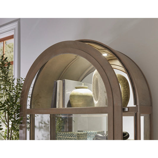 Arch Sliding Door Curio Cabinet by Pulaski Furniture in medium wood. Made from oak veneer in a transitional style.