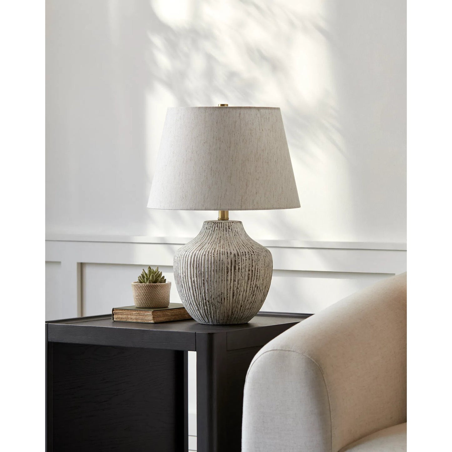 003 SI-2168138 | Lifestyle | Judarn Table Lamp - 531753 by Livabliss in body: white, shade: beige, finial: metallic - brass, harp: metallic - brass, cord: translucent and chromeplated. Made from ceramic, linen, polyester, iron in a modern style.