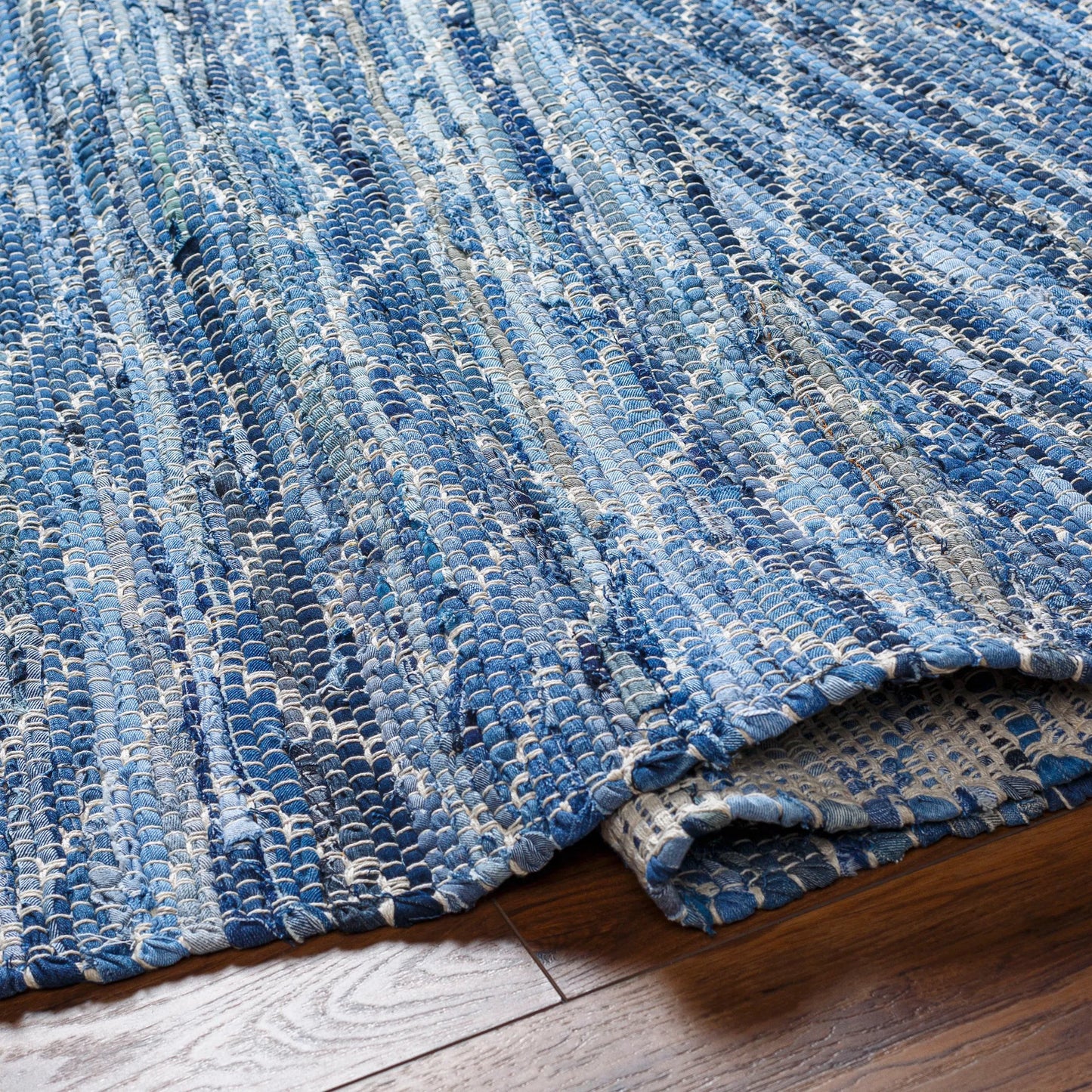 005 SI-1922035,SI-1922036,SI-1922037,SI-1922038,SI-1922039,SI-1922040 | Closeup | Jean Rug - 32477 by Livabliss in tan, beige, dark blue, blue, light blue. Made from main: 100% recycled fabric in a unique style.