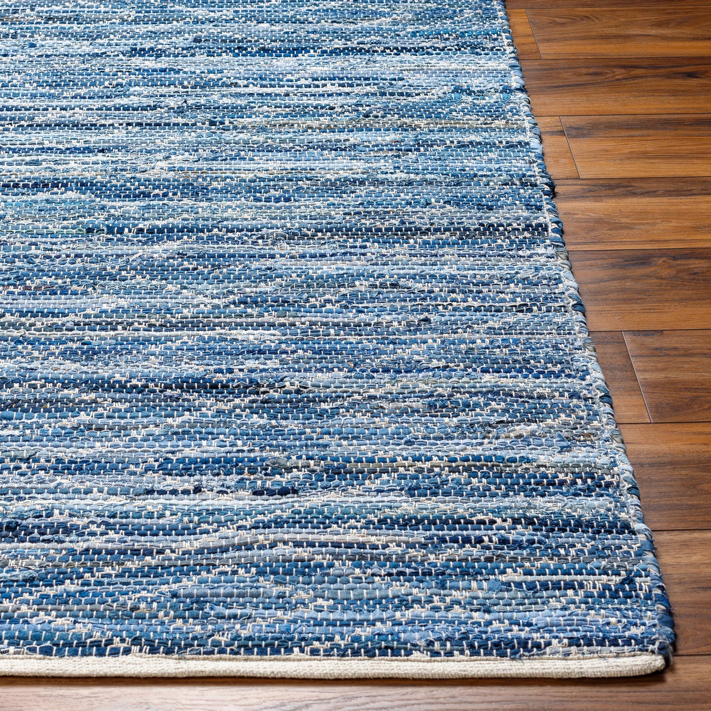 004 SI-1922035,SI-1922036,SI-1922037,SI-1922038,SI-1922039,SI-1922040 | Closeup | Jean Rug - 32477 by Livabliss in tan, beige, dark blue, blue, light blue. Made from main: 100% recycled fabric in a unique style.