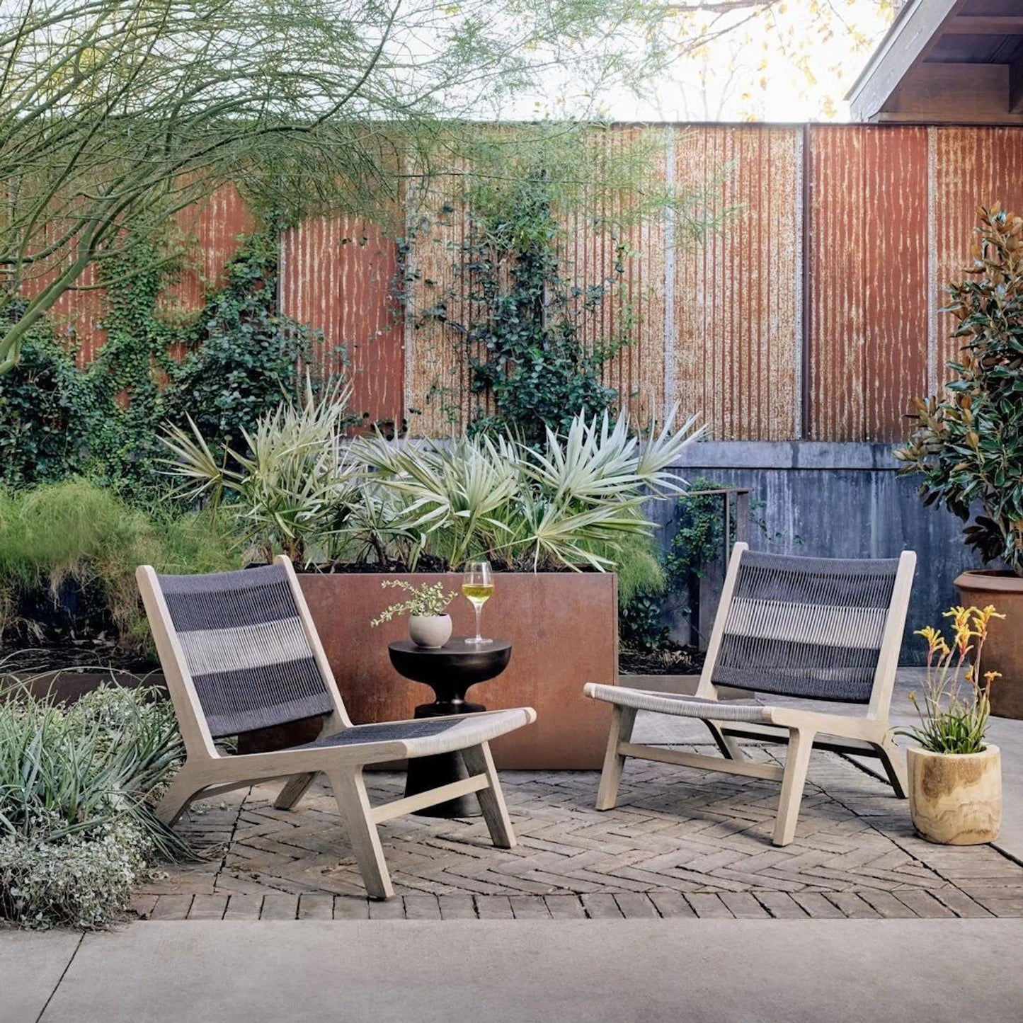 026 SR-809911 | Lifestyle | Julian Outdoor Chair by Four Hands. Made from 100% olefin, solid fsc®-certified teak, 100% polypropylene in a modern style.