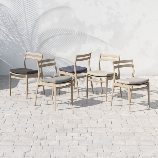 Atherton Outdoor Dining Chair by Four Hands. Made from 100% olefin, solid fsc®-certified teak, 91% polyurethane foam pad, 9% polyester fiber batting in a coastal style.