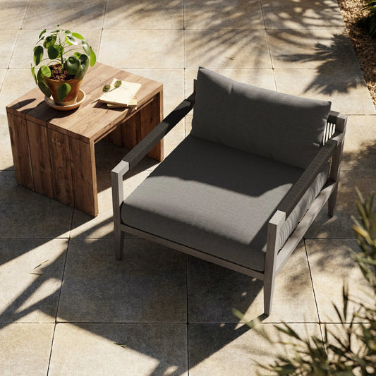 Sherwood Outdoor Chair, Weathered Grey by Four Hands. Made from 100% olefin, solid fsc®-certified teak, 100% polypropylene in a coastal style.