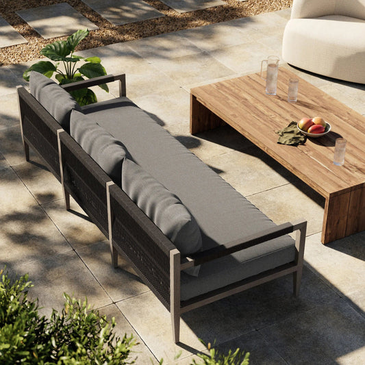 Sherwood Outdoor Sofa, Weathered Grey by Four Hands. Made from 100% olefin, solid fsc®-certified teak, 100% polypropylene in a coastal style.