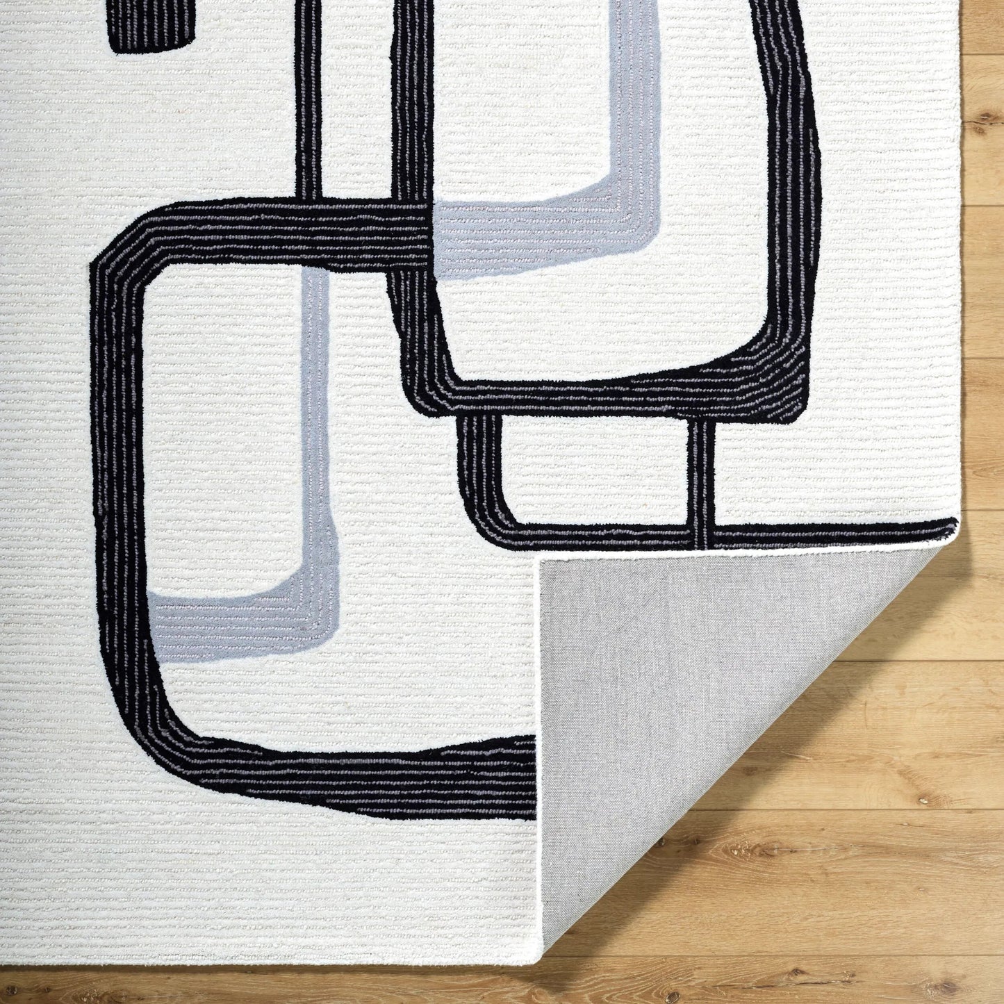 004 SI-2164838,SI-2164839,SI-2164840,SI-2164841 | Closeup | Rossi Rug - 532291 by Livabliss in ash, jet black. Made from wool in a unique style.