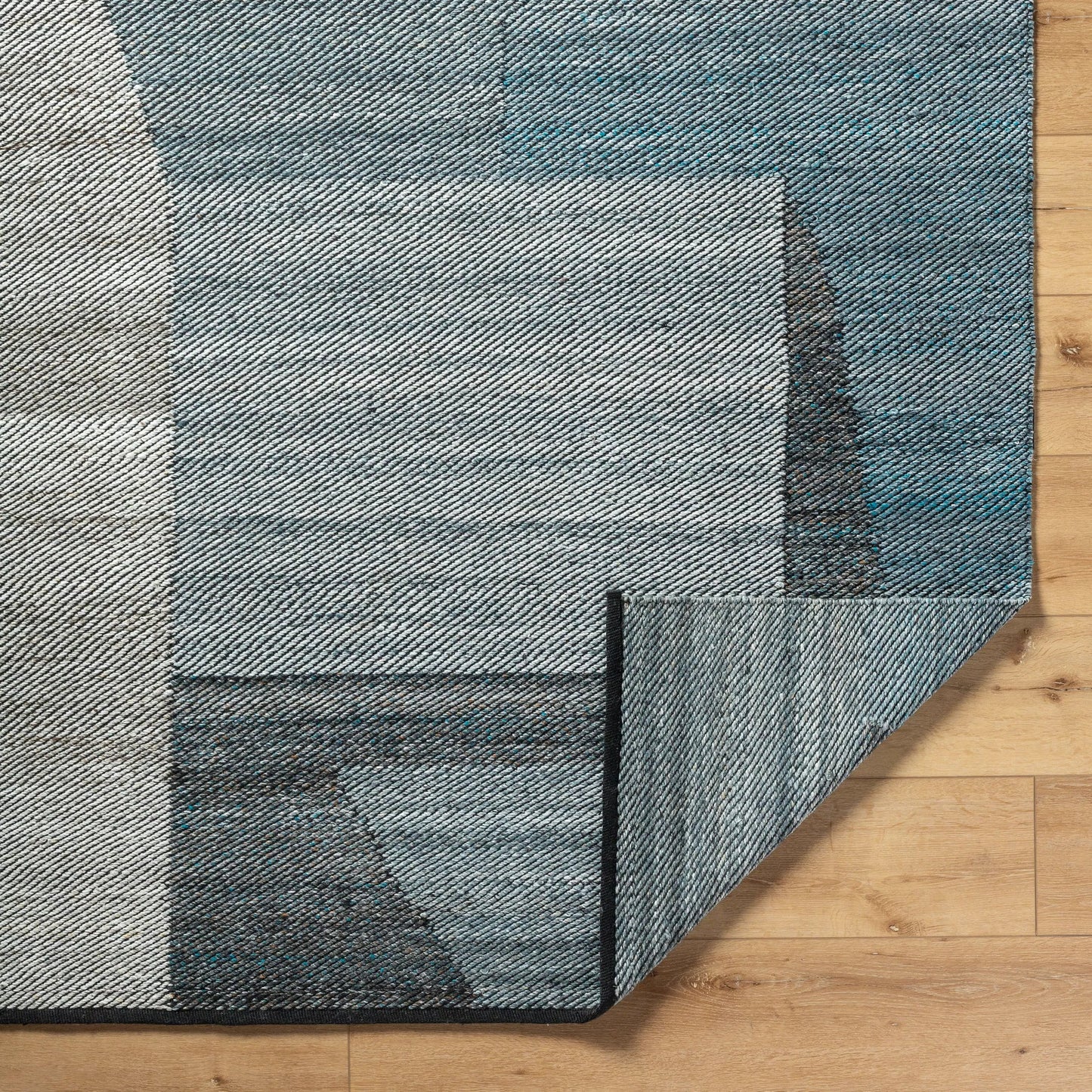 004 SI-2167495,SI-2167496,SI-2167497,SI-2167498 | Closeup | Jocelyn Rug - 484364 by Livabliss in grey, metallic - silver, slate blue, nickel, charcoal. Made from recycled pet yarn in a unique style.