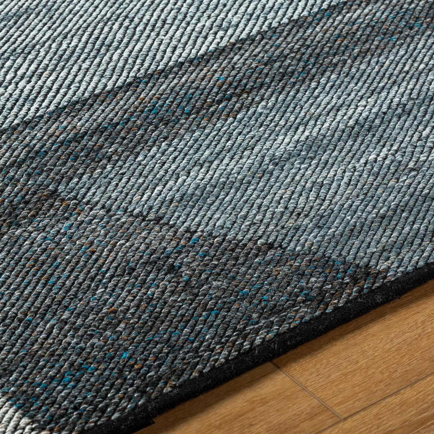 005 SI-2167495,SI-2167496,SI-2167497,SI-2167498 | Closeup | Jocelyn Rug - 484364 by Livabliss in grey, metallic - silver, slate blue, nickel, charcoal. Made from recycled pet yarn in a unique style.