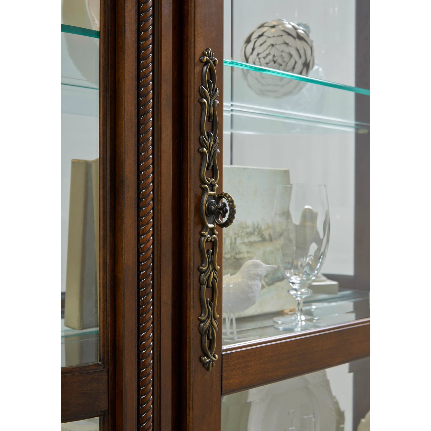 004 SI-2155517 | Closeup | Curved End Curio by Pulaski Furniture in warm maple brown. Made from select hardwood solids, veneers in a traditional style.