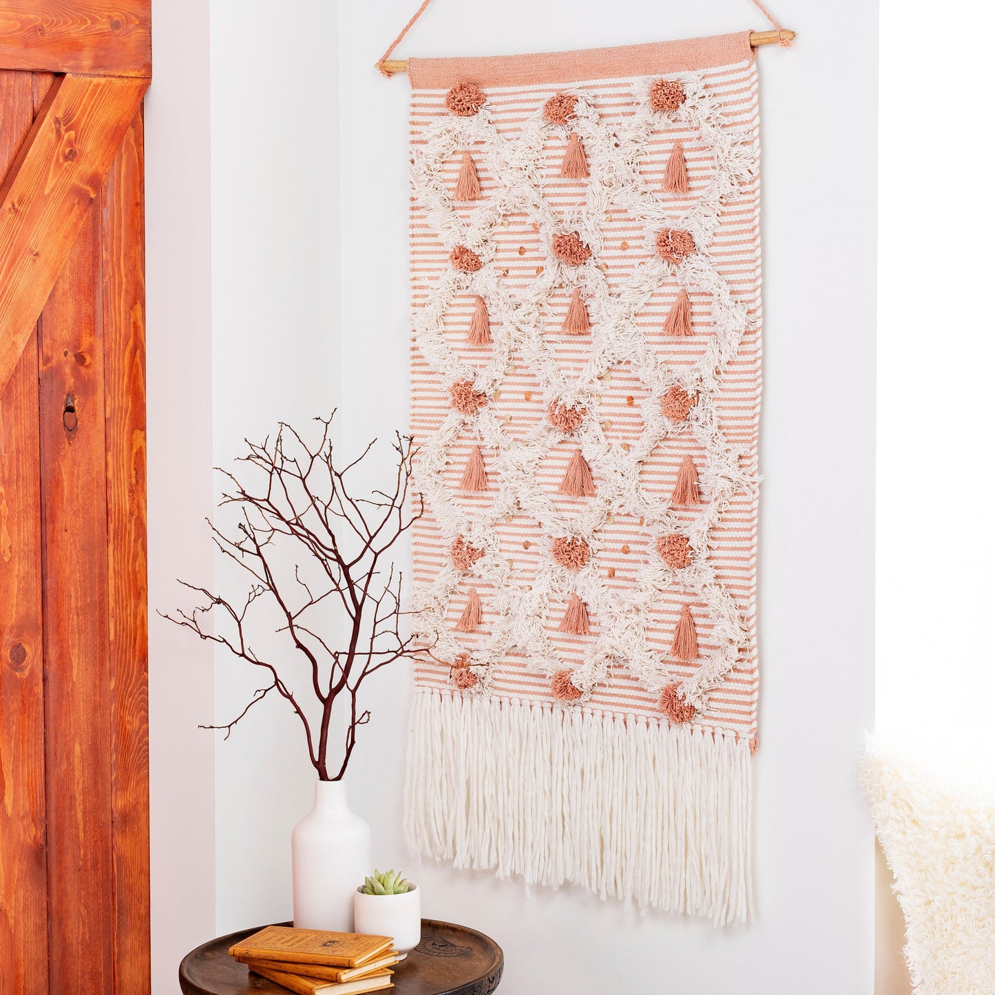 005 SI-1883673,SI-1883674 | Lifestyle | Kari Wall Hanging - 25008 by Livabliss in white, peach. Made from 60% cotton, 40% polyester, 100% wood in a eclectic & global style.