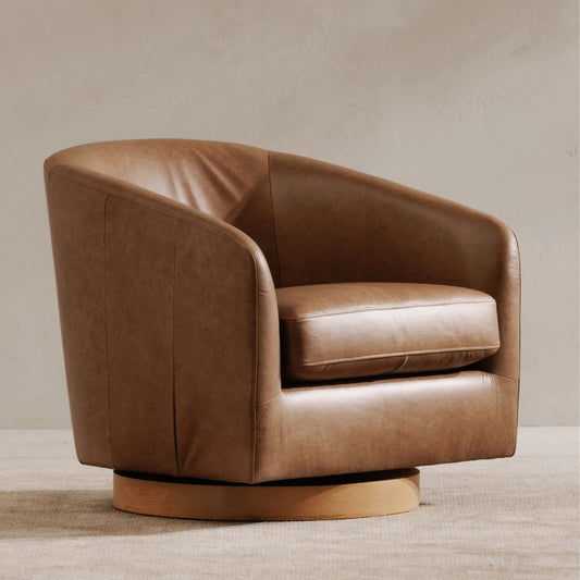Oscy Leather Swivel Chair by Moe's Home Collection in tan. Made from upholstery: 100% top grain leather, solid wood base, pine, poplar frame, feather, high, density foam seat, ash wood base in a unique style.