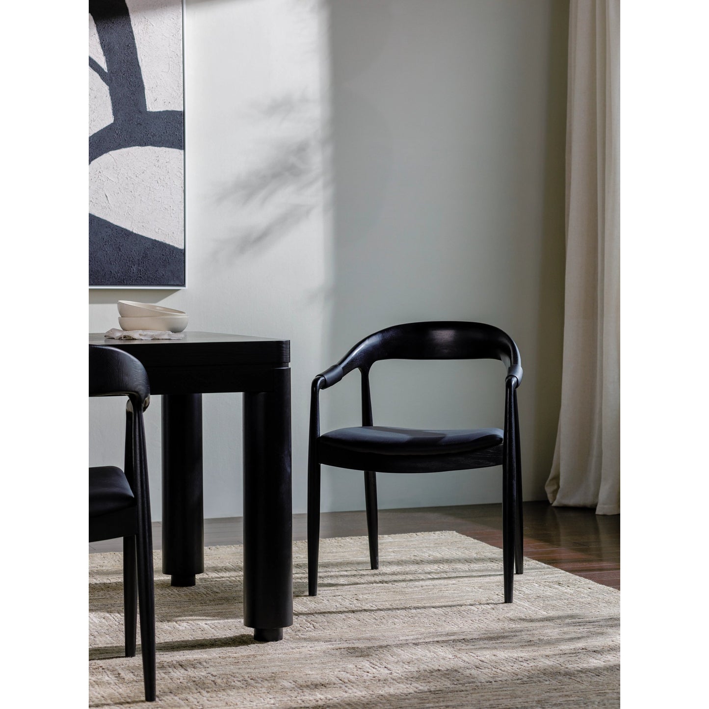 002 SI-2164710 | Lifestyle | Kisco Dining Chair - 530624 by Surya in black and lacquered. Made from faux leather, oak, polyurethane foam, polyester, polyfill in a modern style.