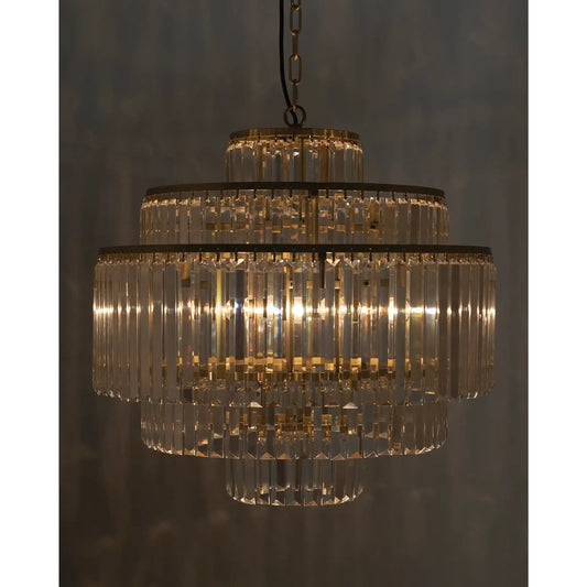 Quintus Chandelier by Noir in antique brass. Made from metal, glass in a traditional style.