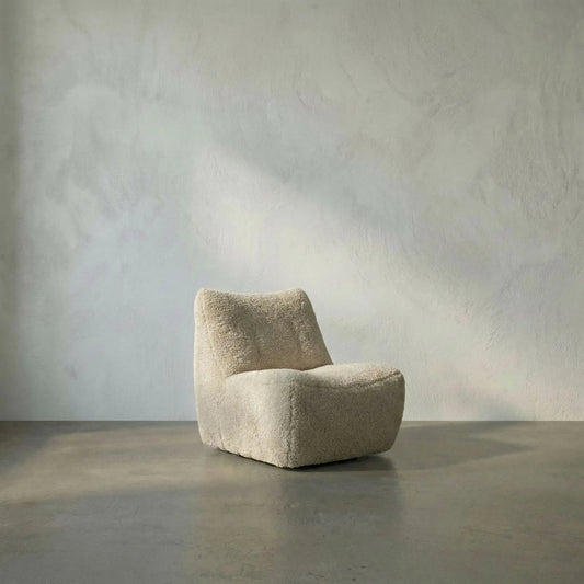McClain Swivel Chair by Noir in camel. Made from teddy fleece in a transitional style.