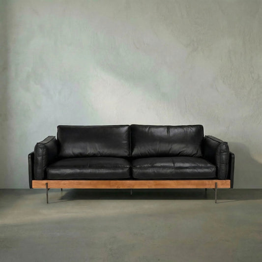 Ray Sofa by Noir in dark walnut, onyx black, and steel gray powder coat. Made from walnut, top-grain leather, and industrial steel in a traditional style.