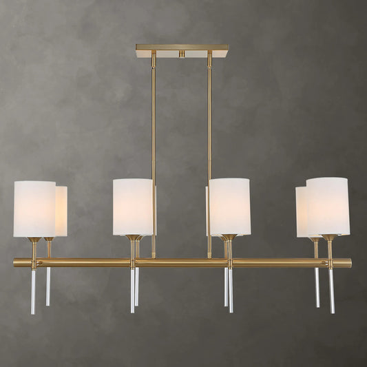 Awyr 8 Light Linear Chandelier by Uttermost in brass. Made from steel, acrylic, fabric in a traditional style.