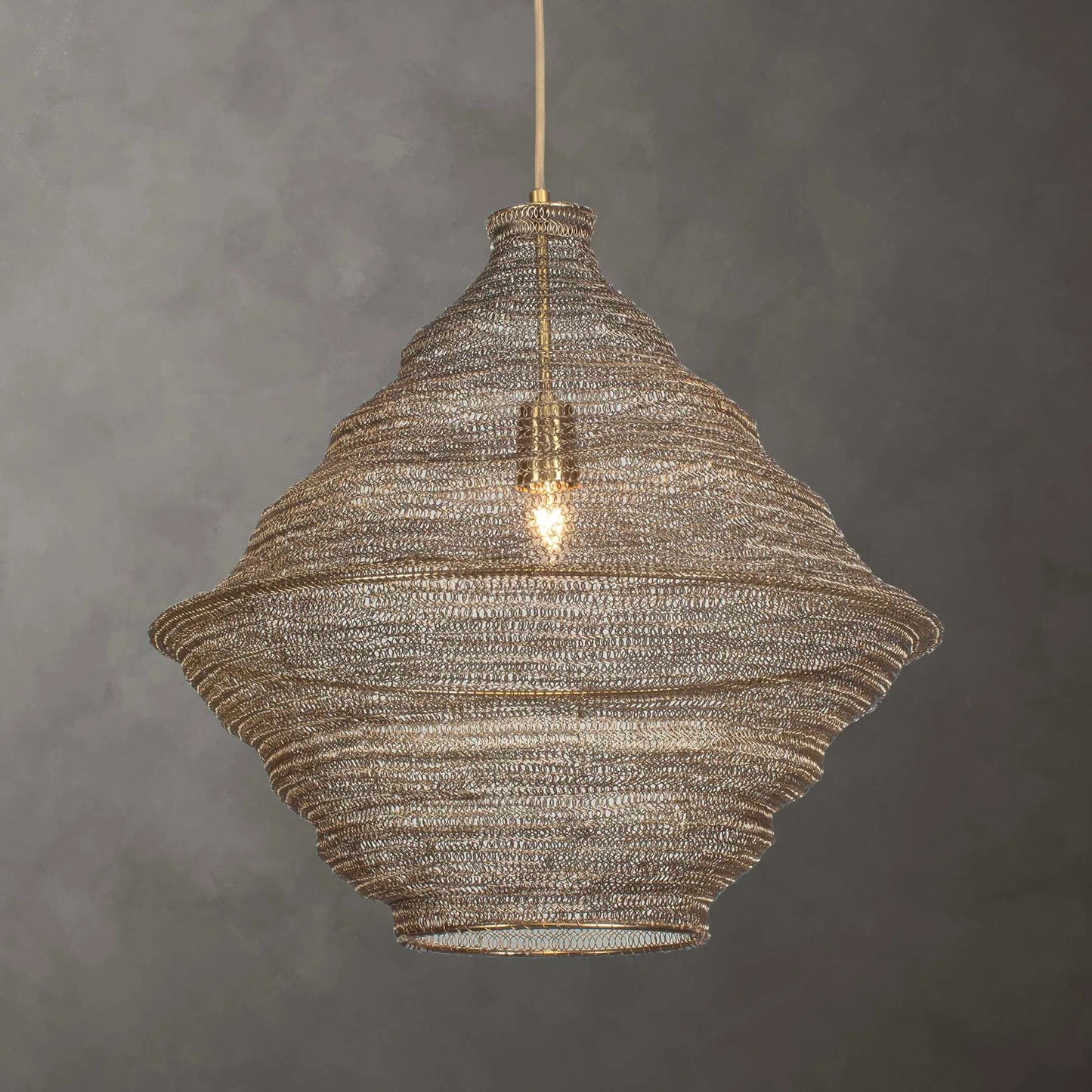 002 SI-2386640 | Lifestyle | Sigh Woven 1 Light Pendant by Uttermost in brass. Made from iron in a rustic style.
