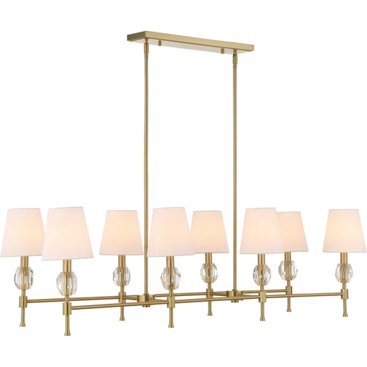 Arques 8 Light Linear Chandelier by Uttermost in brass. Made from iron, fabric, crystal in a transitional style.