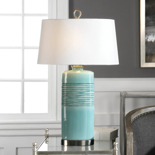 Rila Distressed Teal Table Lamp by Uttermost. Made from ceramic, iron in a modern style.
