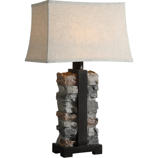 Kodiak Stacked Stone Lamp by Uttermost. Made from concrete, steel, fabric, glass in a rustic style.