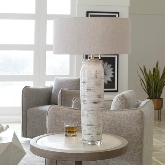 Lenta Table Lamp by Uttermost in white. Made from ceramic, iron, crystal in a transitional style.