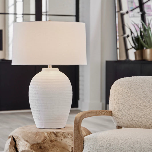 Reyna Table Lamp by Uttermost in chalk white, nickel. Made from steel, ceramic, fabric in a modern style.