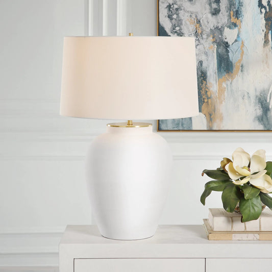 Adelaide Table Lamp by Uttermost in brass. Made from porcelain, fabric, steel in a modern style.