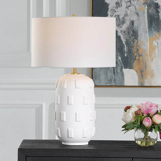 Emerie Textured Table Lamp by Uttermost in brass. Made from porcelain, fabric, steel in a transitional style.