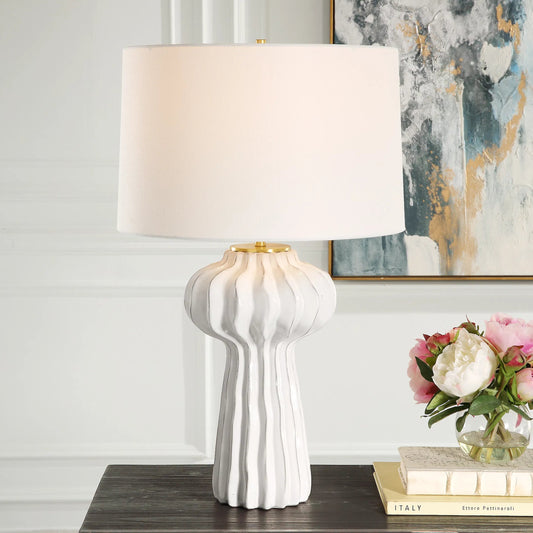 Wrenley Ridged Table Lamp by Uttermost in brass. Made from porcelain, fabric, steel in a modern style.