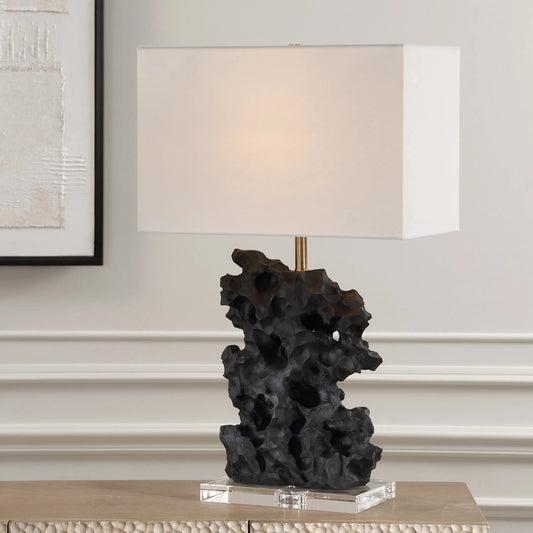 Basalt Table Lamp by Uttermost in brass. Made from steel, crystal, fabric, faux resin in a modern style.