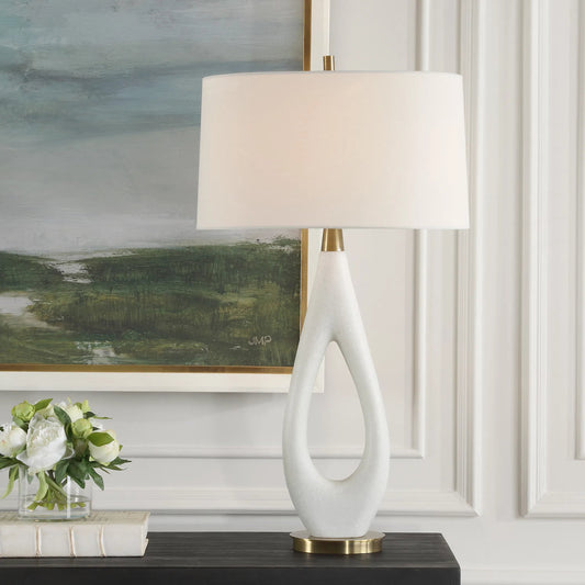 Promenade Table Lamp by Uttermost in brass. Made from steel, rice stone, fabric in a modern style.