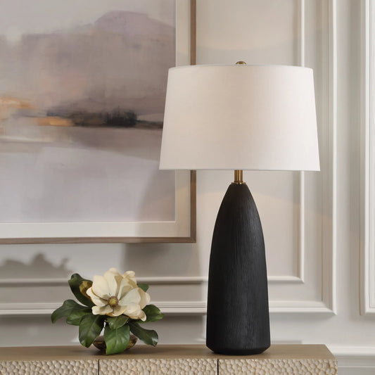 Jett Table Lamp by Uttermost in brass. Made from iron, ceramic, linen in a modern style.