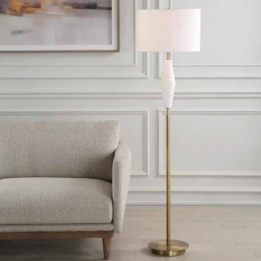 Quite the Buzz Floor Lamp by Uttermost in brass. Made from iron, ceramic, fabric in a transitional style.