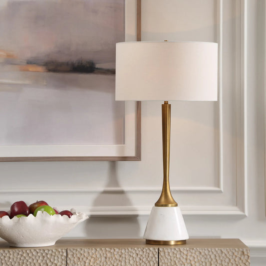 Avola Table Lamp by Uttermost in brass. Made from iron, marble, fabric in a transitional style.