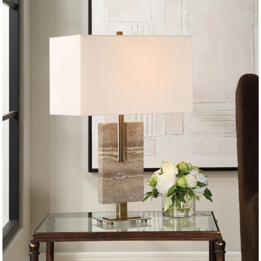 Turning Point Travertine Table Lamp by Uttermost in brass. Made from iron, travertine, fabric in a transitional style.