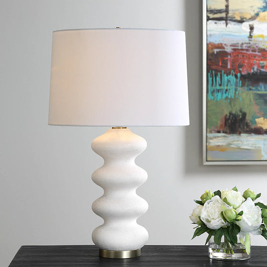 Liora Table Lamp by Uttermost in brass. Made from porcelain, fabric, steel in a transitional style.